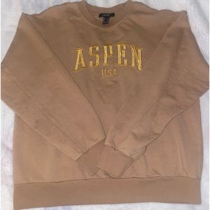 tan/brown crew neck aspen, U.SA wording in gold